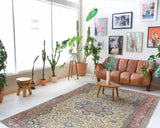 Area rug in a living room setting, pile rug, Turkish rug, old rug, antique rug, pastel colors, faded colors, Turkish rug, vintage rug, soft rug, Portland, Oregon, rug store, rug shop, local shop