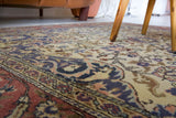 Area rug in a living room setting, pile rug, Turkish rug, old rug, antique rug, pastel colors, faded colors, Turkish rug, vintage rug, soft rug, Portland, Oregon, rug store, rug shop, local shop