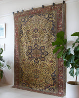 Area rug in a living room setting, pile rug, Turkish rug, old rug, antique rug, pastel colors, faded colors, Turkish rug, vintage rug, soft rug, Portland, Oregon, rug store, rug shop, local shop