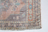 Vintage Turkish mini rug in room decor setting, old rug, antique rug, pastel colors, faded colors, Turkish rug, vintage rug, soft rug, Portland, Oregon, rug store, rug shop, local shop