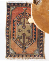 Vintage Turkish mini rug in room decor setting, old rug, antique rug, pastel colors, faded colors, Turkish rug, vintage rug, soft rug, Portland, Oregon, rug store, rug shop, local shop