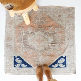 Vintage Turkish mini rug in room decor setting, old rug, antique rug, pastel colors, faded colors, Turkish rug, vintage rug, soft rug, Portland, Oregon, rug store, rug shop, local shop