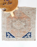 Vintage Turkish mini rug in room decor setting, old rug, antique rug, pastel colors, faded colors, Turkish rug, vintage rug, soft rug, Portland, Oregon, rug store, rug shop, local shop