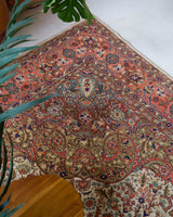 Area rug in a living room setting, pile rug, Turkish rug, old rug, antique rug, pastel colors, faded colors, Turkish rug, vintage rug, soft rug, Portland, Oregon, rug store, rug shop, local shop