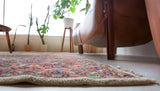 Area rug in a living room setting, pile rug, Turkish rug, old rug, antique rug, pastel colors, faded colors, Turkish rug, vintage rug, soft rug, Portland, Oregon, rug store, rug shop, local shop