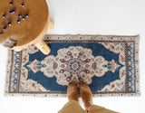 Vintage Turkish mini rug in room decor setting, old rug, antique rug, pastel colors, faded colors, Turkish rug, vintage rug, soft rug, Portland, Oregon, rug store, rug shop, local shop