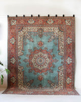 Area rug in a living room setting, pile rug, Turkish rug, old rug, antique rug, pastel colors, faded colors, Turkish rug, vintage rug, soft rug, Portland, Oregon, rug store, rug shop, local shop