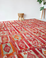Vintage kilim rug in room decor setting, kilim, Turkish rug, vintage rug, portland, rug shop, bright colors, wild shaman, soft rug, bold color, Portland, Oregon, rug store, rug shop, local shop, antique rug