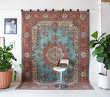 Area rug in a living room setting, pile rug, Turkish rug, old rug, antique rug, pastel colors, faded colors, Turkish rug, vintage rug, soft rug, Portland, Oregon, rug store, rug shop, local shop