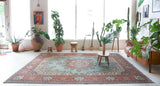 Area rug in a living room setting, pile rug, Turkish rug, old rug, antique rug, pastel colors, faded colors, Turkish rug, vintage rug, soft rug, Portland, Oregon, rug store, rug shop, local shop