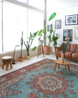 Area rug in a living room setting, pile rug, Turkish rug, old rug, antique rug, pastel colors, faded colors, Turkish rug, vintage rug, soft rug, Portland, Oregon, rug store, rug shop, local shop