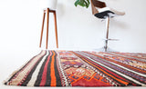Vintage kilim rug in room decor setting, kilim, Turkish rug, vintage rug, portland, rug shop, bright colors, wild shaman, soft rug, bold color, Portland, Oregon, rug store, rug shop, local shop, antique rug