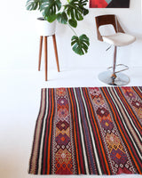 Vintage kilim rug in room decor setting, kilim, Turkish rug, vintage rug, portland, rug shop, bright colors, wild shaman, soft rug, bold color, Portland, Oregon, rug store, rug shop, local shop, antique rug