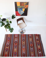 Vintage kilim rug in room decor setting, kilim, Turkish rug, vintage rug, portland, rug shop, bright colors, wild shaman, soft rug, bold color, Portland, Oregon, rug store, rug shop, local shop, antique rug