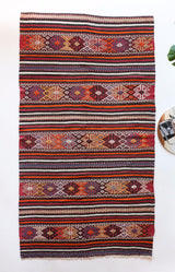 Vintage kilim rug in room decor setting, kilim, Turkish rug, vintage rug, portland, rug shop, bright colors, wild shaman, soft rug, bold color, Portland, Oregon, rug store, rug shop, local shop, antique rug
