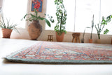 Area rug in a living room setting, pile rug, Turkish rug, old rug, antique rug, pastel colors, faded colors, Turkish rug, vintage rug, soft rug, Portland, Oregon, rug store, rug shop, local shop