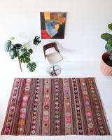 Vintage kilim rug in room decor setting, kilim, Turkish rug, vintage rug, portland, rug shop, bright colors, wild shaman, soft rug, bold color, Portland, Oregon, rug store, rug shop, local shop, antique rug