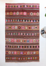 Vintage kilim rug in room decor setting, kilim, Turkish rug, vintage rug, portland, rug shop, bright colors, wild shaman, soft rug, bold color, Portland, Oregon, rug store, rug shop, local shop, antique rug