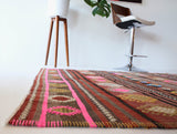 Vintage kilim rug in room decor setting, kilim, Turkish rug, vintage rug, portland, rug shop, bright colors, wild shaman, soft rug, bold color, Portland, Oregon, rug store, rug shop, local shop, antique rug