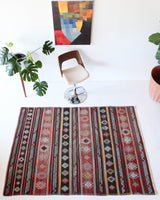 Vintage kilim rug in room decor setting, old rug, antique rug, pastel colors, faded colors, Turkish rug, vintage rug, soft rug, Portland, Oregon, rug store, rug shop, local shop