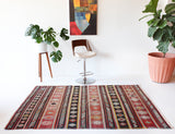 Vintage kilim rug in room decor setting, old rug, antique rug, pastel colors, faded colors, Turkish rug, vintage rug, soft rug, Portland, Oregon, rug store, rug shop, local shop