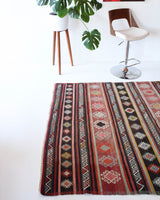 Vintage kilim rug in room decor setting, old rug, antique rug, pastel colors, faded colors, Turkish rug, vintage rug, soft rug, Portland, Oregon, rug store, rug shop, local shop