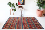 Vintage kilim rug in room decor setting, old rug, antique rug, pastel colors, faded colors, Turkish rug, vintage rug, soft rug, Portland, Oregon, rug store, rug shop, local shop