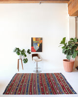 Vintage kilim rug in room decor setting, old rug, antique rug, pastel colors, faded colors, Turkish rug, vintage rug, soft rug, Portland, Oregon, rug store, rug shop, local shop