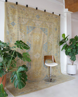 Vintage Turkish rug in living room setting, old rug, antique rug, pastel colors, faded colors, Turkish rug, vintage rug, soft rug, Portland, Oregon, rug store, rug shop, local shop