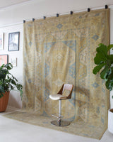 Vintage Turkish rug in living room setting, old rug, antique rug, pastel colors, faded colors, Turkish rug, vintage rug, soft rug, Portland, Oregon, rug store, rug shop, local shop