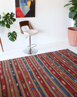 Vintage kilim rug in room decor setting, old rug, antique rug, pastel colors, faded colors, Turkish rug, vintage rug, soft rug, Portland, Oregon, rug store, rug shop, local shop