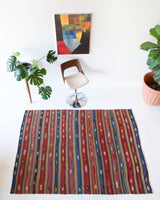 Vintage kilim rug in room decor setting, old rug, antique rug, pastel colors, faded colors, Turkish rug, vintage rug, soft rug, Portland, Oregon, rug store, rug shop, local shop