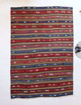 Vintage kilim rug in room decor setting, old rug, antique rug, pastel colors, faded colors, Turkish rug, vintage rug, soft rug, Portland, Oregon, rug store, rug shop, local shop