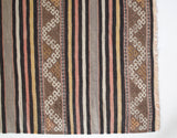 Vintage kilim rug in room decor setting, old rug, antique rug, pastel colors, faded colors, Turkish rug, vintage rug, soft rug, Portland, Oregon, rug store, rug shop, local shop, distressed rug, worn out rug