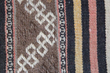Vintage kilim rug in room decor setting, old rug, antique rug, pastel colors, faded colors, Turkish rug, vintage rug, soft rug, Portland, Oregon, rug store, rug shop, local shop, distressed rug, worn out rug