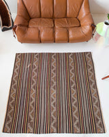Vintage kilim rug in room decor setting, old rug, antique rug, pastel colors, faded colors, Turkish rug, vintage rug, soft rug, Portland, Oregon, rug store, rug shop, local shop, distressed rug, worn out rug