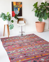Vintage Turkish rug in a living room setting, pile rug, Turkish rug, vintage rug, portland, rug shop, bright colors, wild shaman, soft rug, bold color, Portland, Oregon, rug store, rug shop, local shop