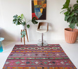 Vintage Turkish rug in a living room setting, pile rug, Turkish rug, vintage rug, portland, rug shop, bright colors, wild shaman, soft rug, bold color, Portland, Oregon, rug store, rug shop, local shop