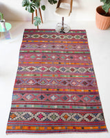 Vintage Turkish rug in a living room setting, pile rug, Turkish rug, vintage rug, portland, rug shop, bright colors, wild shaman, soft rug, bold color, Portland, Oregon, rug store, rug shop, local shop