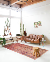 Vintage kilim rug in room decor setting, old rug, antique rug, pastel colors, faded colors, Turkish rug, vintage rug, soft rug, Portland, Oregon, rug store, rug shop, local shop, distressed rug, worn out rug