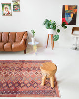 Vintage kilim rug in room decor setting, old rug, antique rug, pastel colors, faded colors, Turkish rug, vintage rug, soft rug, Portland, Oregon, rug store, rug shop, local shop, distressed rug, worn out rug