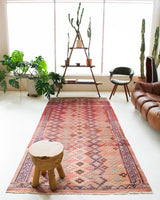 Vintage kilim rug in room decor setting, old rug, antique rug, pastel colors, faded colors, Turkish rug, vintage rug, soft rug, Portland, Oregon, rug store, rug shop, local shop, distressed rug, worn out rug