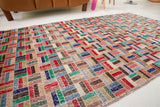 Vintage art deco rug in a living room setting, pile rug, Turkish rug, custom rug, modern rug, art deco rug,  portland, rug shop, bright colors, wild shaman, low pile rug, bold color, Portland, Oregon, rug store, rug shop, local shop, made in Turkey, vintage rug, retro rug