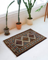 Vintage mini kilim rug in room decor setting, kilim, Turkish rug, vintage rug, portland, rug shop, bright colors, wild shaman, soft rug, bold color, Portland, Oregon, rug store, rug shop, local shop