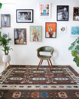 Vintage kilim rug in room decor setting, old rug, antique rug, pastel colors, faded colors, Turkish rug, vintage rug, soft rug, Portland, Oregon, rug store, rug shop, local shop, bold colors, bright colors, faded colors