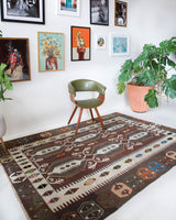 Vintage kilim rug in room decor setting, old rug, antique rug, pastel colors, faded colors, Turkish rug, vintage rug, soft rug, Portland, Oregon, rug store, rug shop, local shop, bold colors, bright colors, faded colors