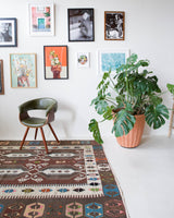 Vintage kilim rug in room decor setting, old rug, antique rug, pastel colors, faded colors, Turkish rug, vintage rug, soft rug, Portland, Oregon, rug store, rug shop, local shop, bold colors, bright colors, faded colors