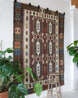 Vintage kilim rug in room decor setting, old rug, antique rug, pastel colors, faded colors, Turkish rug, vintage rug, soft rug, Portland, Oregon, rug store, rug shop, local shop, bold colors, bright colors, faded colors