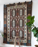 Vintage kilim rug in room decor setting, old rug, antique rug, pastel colors, faded colors, Turkish rug, vintage rug, soft rug, Portland, Oregon, rug store, rug shop, local shop, bold colors, bright colors, faded colors