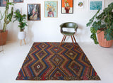 Vintage kilim rug in living room setting, bright colors, wild shaman, soft rug, bold color, Portland, Oregon, rug store, rug shop, local shop, vintage rug, modern kilim, warm colors